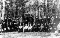 Куртамыш. Выпуск сельского  двухклассного мужского училища Мин. Нар. Прос., 1912 год — Заведующий Константин Захарович Павлов в центре педагогического коллектива и выпускников. Рядом стоят: учитель Тюпкин Степан Тимофеевич, законоучитель о. Виталий (Милицын), учитель пения, военрук Кондаков Михаил Львович, сидят: учительницы Лосева (Маурина) Евгения Ивановна, Зеленовская (Тюпкина) Марина Александровна и Кичигина Клавдия Ивановна. Из архива Куртамышского музея.